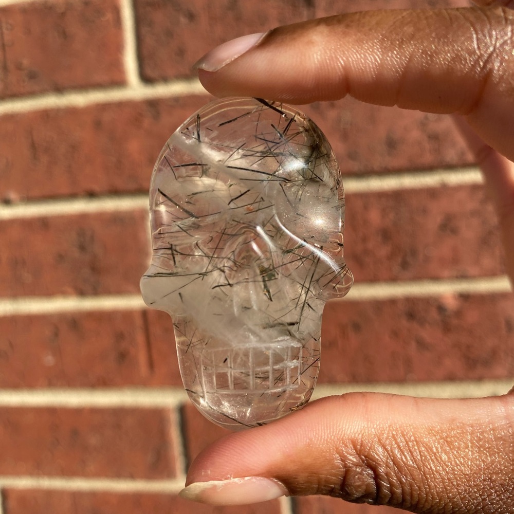 Quartz and Black Tourmaline Skull Palm Stone
